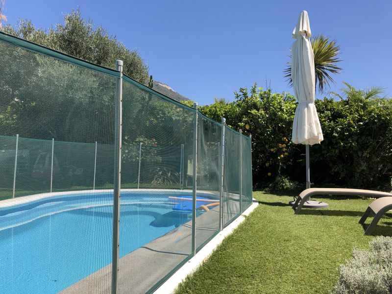 Backyard with Mesh Pool Fence
